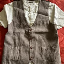 Lovely next signature grandad collar shirt and matching waistcoat age 9 years. 
I tire doesn’t really do it much justice.