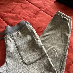 Grey under armour jogger bottoms size Medium youth. ? Age 10/11