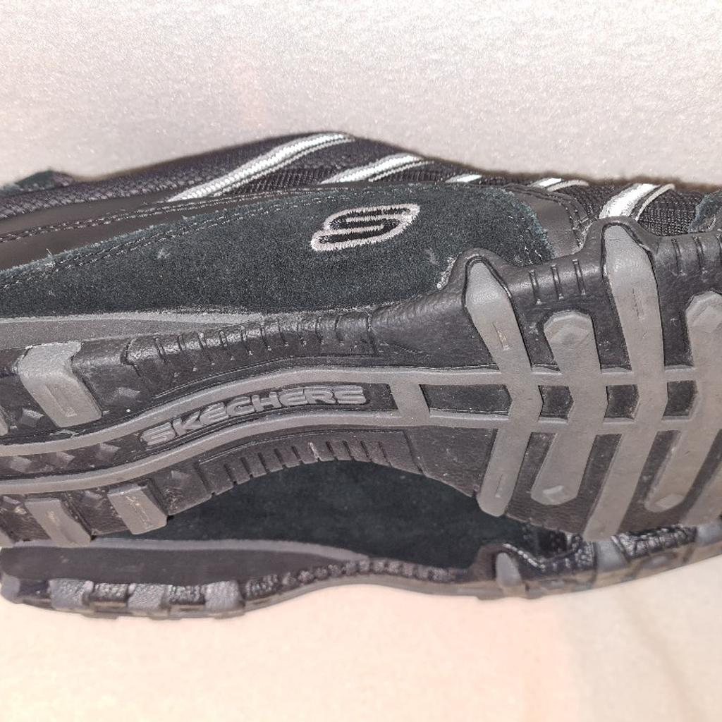 Skechers size 7 trainers in worn once indoors condition black with grey stripes. See photos for condition, size and materials. I can offer try before you buy option if local, but if viewing on an auction site viewing STRICTLY prior to end of auction.  If you bid and win it's yours. Cash on collection or post at extra cost which is £4.55 Royal Mail 2nd class. I can offer free local delivery within five miles of my postcode which is LS104NF. Listed on five other sites so it may end abruptly. Don't be disappointed. Any questions please ask and I will answer asap.