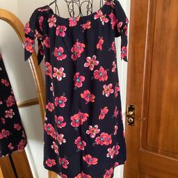 Mini dress
Size 10
Navy with pink flowers
Full elastic neck line
Split cap sleeves with ties
23” long from underarm approx 
From papaya
Collection or postage available