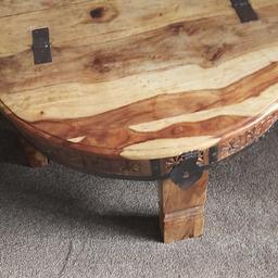 round solid wood large living room table..opens halfway..30 inches circumference and 16 inches height.. good for light storage, open to good offers