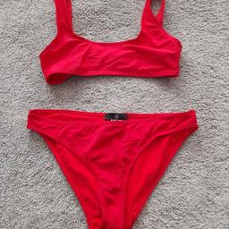 Missguided Red Bikini Excellent Condition. Hardly Worn. Pull on top is size 8. Bikini bottoms are size 10. From smoke and pet free home, check out my other items. Happy to combine postage when possible for multiple purchases or collection from DL5. Thanks for looking.