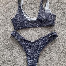 Navy And White spot Bikini Excellent Condition. Can't remember where purchased from. Size small. Wide straps and padded bra, removable if desired. Pull over. Hardly Worn. From smoke and pet free home, check out my other items. Happy to combine postage for multiple purchases when possible or collection from DL5. Thanks for looking.