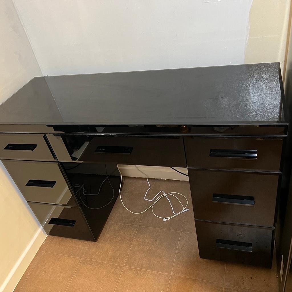 Next High gloss black dressing table with 6 side drawers and 1 under desk drawer. Used but great condition
Glass table
Measures:
120cm wide
81cm high
44cm depth

Collection only