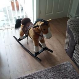 Childs rocking horse with press ear for moving mouth and tail noises horse