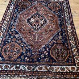 Hamadan rug, central lozenge medallion on a red round, blue ground field with stylish flowers, multi boarded, 165cm x 121cm