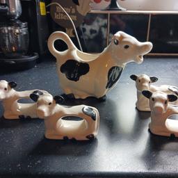 ihave a lovely little cow milk jug and 4 calf napkin holders just been displayed having a clear out