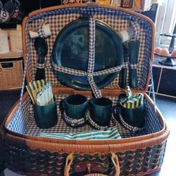 classic pick nic hamper in green with plates cups napkins salt pepper knives and forks just don't use anymore as daughter bought us a cooling one but very classic original