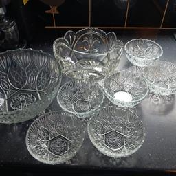 Two beautiful  glass fruit bowls and 6 smaller glass desert bowls very pretty no longer use just  clearing stuff out