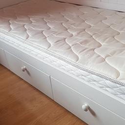 White Single bed three sliding storage drawers on the side. Has a new silent night mattress. Hardly used excellent condition. Can use a comfortable skattable cushion sofa for Relaxing reading or play.