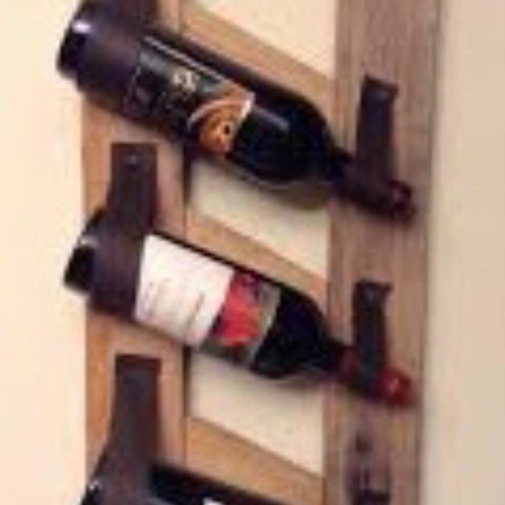 Rustic Wooden 3 Bottle Wine Rack, handmade with reclaimed timber and Supasoft Italian Leather bottle supports.

Comes in its natural timber state

Holds up to 3 bottles.

Please note……..wine bottles are not included.

This has been made as eco and planet friendly as possible by using only reclaimed and recycled materials and that includes all fixings.

In using recycled materials it also gives it a lovely rustic appearance and as such it may have a degree of imperfections from its previous life which give it real character and charm which may include nail holes, saw marks, dents, chips, little digs and nicks all of which have been deliberately left on to give it that aged effect.

Equivalent are selling online for £60.00.

Grab a bargain at just £15.00

Cash on collection only.