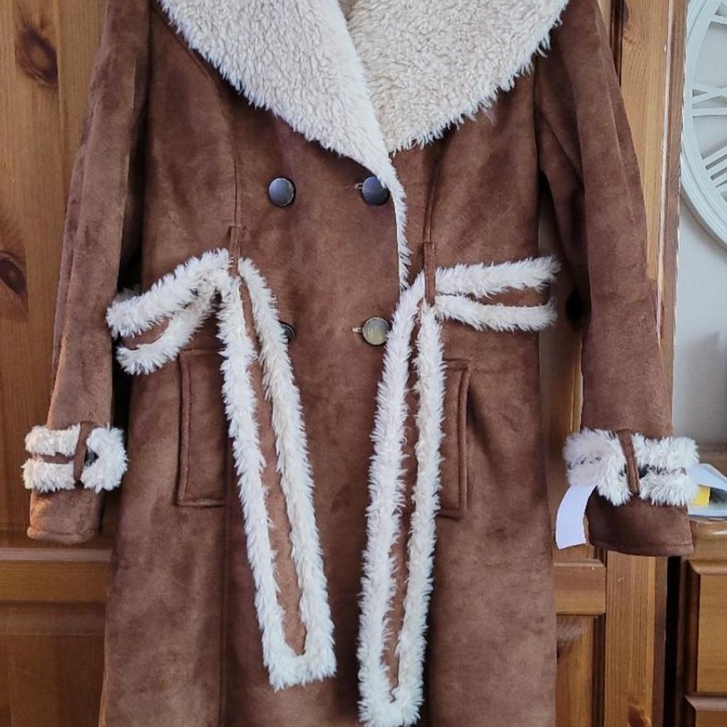BNWT, beautiful quality coat.
100% polyester.
Very warm, faux suede look and faux fur lining.
RRP £270.
Collection only WV14.