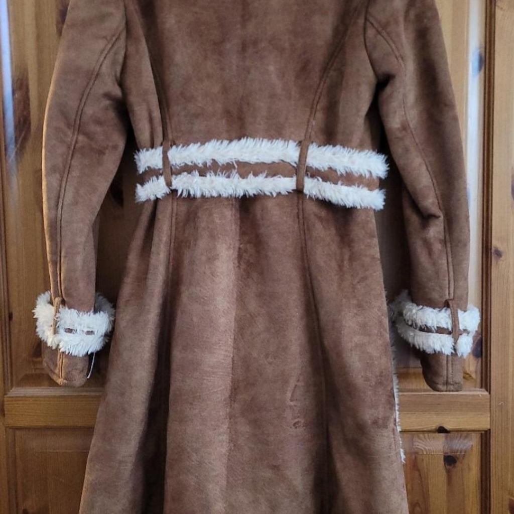 BNWT, beautiful quality coat.
100% polyester.
Very warm, faux suede look and faux fur lining.
RRP £270.
Collection only WV14.