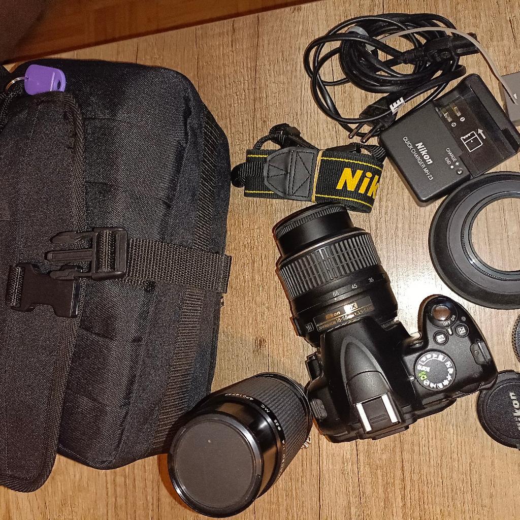 Verkauf einer Nikon D 3000 mit 2 Objektiven, 1 x Nikon -Nikkor 18-55 AF+MF,VR mit Sonnenblende und 1 x Kiron 80-200 analog, sowie Trageriemen und Tasche und Ladegerät plus Akku