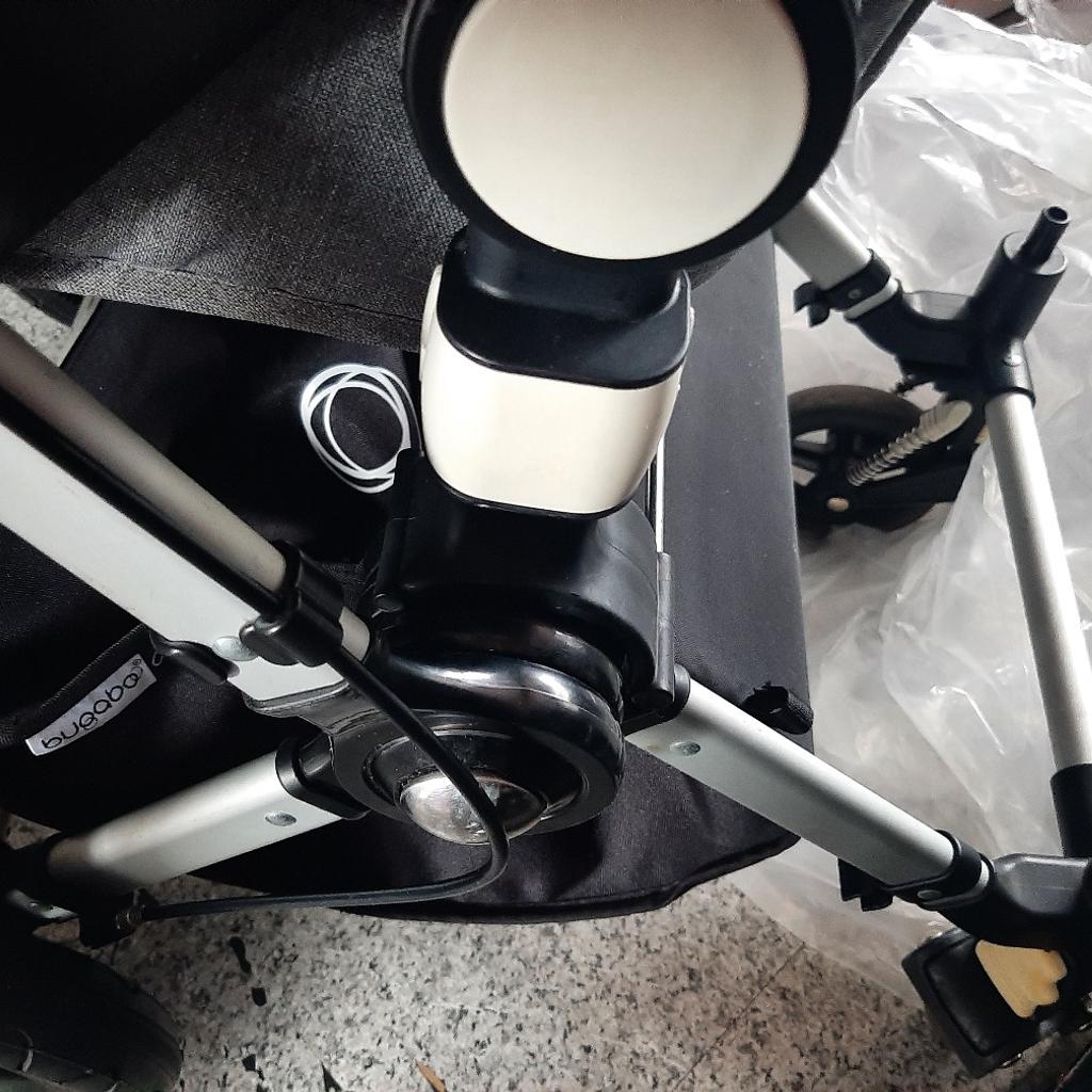 bugaboo cameleon in gray still good condition comes with seat hood rods bumper bar, basket (new) handle bar covers (new). rain cover