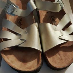 Betula by Birkenstock.sandles. Size 6 EU 39. .Silver with buckle and 3 straps. Leather slip on sandles with wood sole. Rubber bottoms are non slip. Genuine Leather.