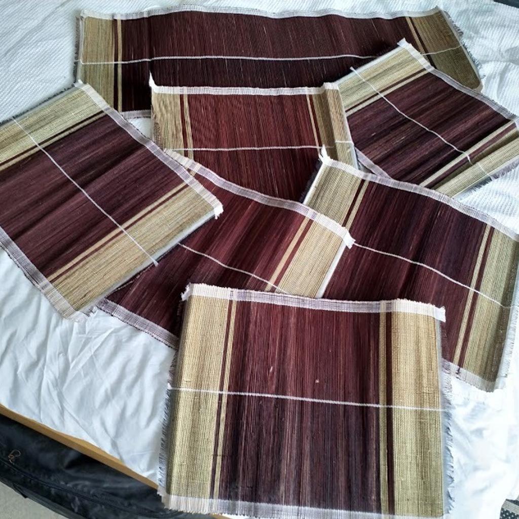 Set of 7 Beige & Burgundy African Handwoven Table Placemats with Runner. Unique from Uganda. Runner measures 85cm wide x 32cm high and 6 x mats 40cm wide x 32cm. Lightweight and rolls to a small package for easy storage. Brand New.