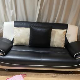 Cream and black 2 seater and 3 seater PVA sofas. In good condition, but a small rip on the top of it which is not noticeable.