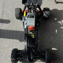 2 stroke Baja rc buggy with control some red anodized parts runs great