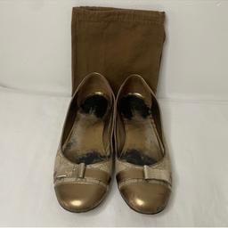 Genuine Gucci gold and beige flat shoes. These are U.K. 4.5 size but run on the large size, they can fit a 5 or 5.5. I used padding at the front as they were a little loose

They have been worn as you can see from the pictures, but most of the wear is on the insoles. The exterior canvas has no stains, wearing or any sort of damage. The exterior gold has some scuff marks, and slight fading at the bottom but not very noticeable. The insole is faded and can be easily replaced with a new insole.
Shoes have been sanitised.

DOES NOT COME WITH THE DUSTBAG.

Comes from smoke and pet free home

Plz feel free to ask any questions

No returns or refunds

Can drop off locally for small additional charge.

Thank you for looking