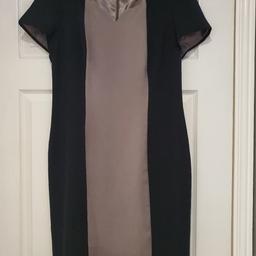 Panelled dress that is fully lined. Wide neckline with small v cut out at neck. Only worn once as slightly too tight for me. (I'd say a smallish size 16) concealed zip
 Slight puckering on inside seams of lining. Black and a stony beige panel. Sleeves have small pleats. Decent weight to the fabric. Length approx 40" shoulder to hem.
