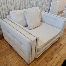 Sofology studded settee and love chair in cream. Very good condition with no marks rips or tears. Cost £3k new. Move forces sale, Collection only.
