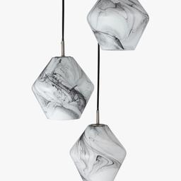Tactile and contemporary, this cluster of three lights will complement modern settings. Cut to a unique, geometric shape, each pendant is crafted from glass and finished with a monochrome marble effect pattern. Easy to adjust the length for your space, it will suit both bedrooms and living spaces.