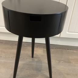 BLACK SIDE TABLE STANDS 24 INCHES HIGH X 15 INCHES DIAMETER, WITH DRAW.  SMALL MARK ON TOP NOT REALLY NOTICEABLE.  BARGAIN 10.00 O.N.O