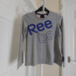 Tee Shirt "Reebok"

Grey Colour

New With Tags

Actual size: cm

Length: 52 cm

Length: 33 cm from armpit side

Shoulder width: 30 cm

Length sleeves: 51 cm

Volume hand: 31 cm

Volume bust: 73 cm – 74 cm

Volume waist: 72 cm – 74 cm

Volume hips: 74 cm – 76 cm

Size: 9-10 Years ( UK ) Eur 140 cm, USA S

Main Material: 100 % Cotton

Made in Sri Lanka

Price £20.90