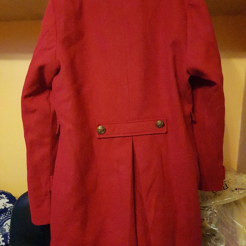 really nice warm coat made for a 15 year old but could fit others really good quality from next brand new with tags never been worn and embellished buttons to bring the mood