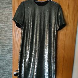 beautiful silver sequin evening dress. round neck, brand new with tags. fully lined. more like a size 14