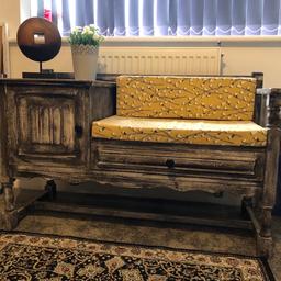 Solid hardwood telephone table or window seat has been painted and had new seat cushions bought and covered.
Good solid piece of furniture- two man lift don’t be deceived by its size!
Height 62
Width 43
Depth 108cm
Cushions are included - ornaments are not!