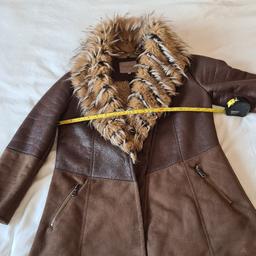 Beautiful River Island Faux Fur, Faux sheepskin and Faux leather jacket. 1st 2c. Uk size 6 in excellent condition. See photos for condition, flaws, size and materials. I can offer try before you buy option but if viewing on an auction site viewing STRICTLY prior to end of auction.  If you bid and win it's yours. Cash on collection or post at extra cost which is £4.55 Royal Mail 2nd class. I can offer free local delivery within five miles of my postcode which is LS104NF. Listed on five other sites so it may end abruptly. Don't be disappointed. Any questions please ask and I will answer asap.