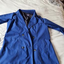 Ladies Blue Gap Trench Coat In Excellent Condition. See photos for condition, flaws, size and materials. I can offer try before you buy option but if viewing on an auction site viewing STRICTLY prior to end of auction.  If you bid and win it's yours. Cash on collection or post at extra cost which is £4.55 Royal Mail 2nd class. I can offer free local delivery within five miles of my postcode which is LS104NF. Listed on five other sites so it may end abruptly. Don't be disappointed. Any questions please ask and I will answer asap.