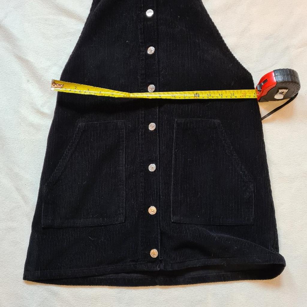 Topshop Moto Black Corduroy Pinafore Dungaree Dress, Size 10 (UK). Excellent superb condition. 1st 2c will buy. See photos for condition, flaws, size and materials. I can offer try before you buy option but if viewing on an auction site viewing STRICTLY prior to end of auction.  If you bid and win it's yours. Cash on collection or post at extra cost which is £4.55 Royal Mail 2nd class. I can offer free local delivery within five miles of my postcode which is LS104NF. Listed on five other sites so it may end abruptly. Don't be disappointed. Any questions please ask and I will answer asap.