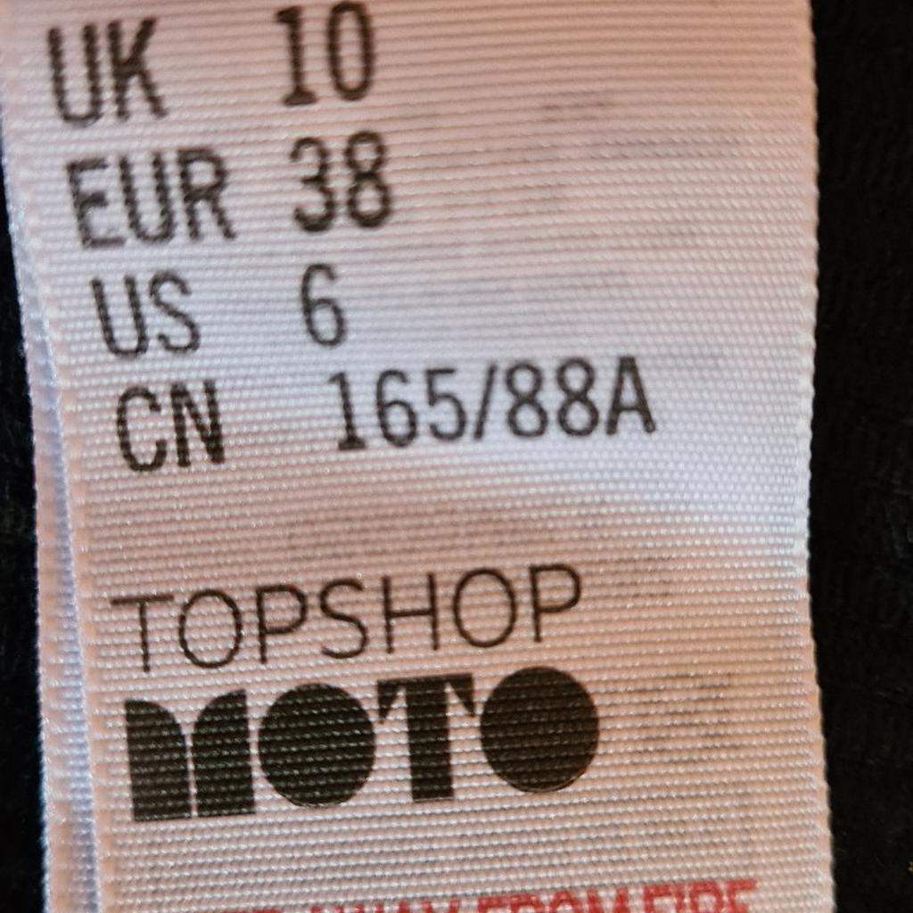 Topshop Moto Black Corduroy Pinafore Dungaree Dress, Size 10 (UK). Excellent superb condition. 1st 2c will buy. See photos for condition, flaws, size and materials. I can offer try before you buy option but if viewing on an auction site viewing STRICTLY prior to end of auction.  If you bid and win it's yours. Cash on collection or post at extra cost which is £4.55 Royal Mail 2nd class. I can offer free local delivery within five miles of my postcode which is LS104NF. Listed on five other sites so it may end abruptly. Don't be disappointed. Any questions please ask and I will answer asap.