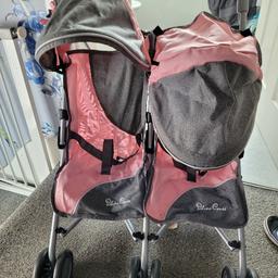 hardly used dolls double pram. extendable handles, shopping baskets. easy to store.