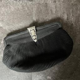 Vintage Art Deco black evening clutch bag, gorgeous item with inner clip fastened purse and mirror. Has beautiful paste clasp sadly a few little pastes missing, I should have vintage rhinestones to replace them so will do it for buyer. Has a carry handle. PLEASE PAY ATTENTION TO PHOTOS. Used items so may have signs of wear or defects. Please see all photos as is part of description, post and combine items. No returns.