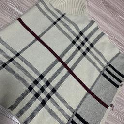 Ladies Poncho only worn once in very good condition. Cream with black and burgundy stripes going across as in the pictures.