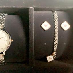 Armani ladies watch and earring set and bracelet with 6 months of warranty. proof of purchase is available. Collect from Bd3 leeds Road near mcdonald's or I can deliver anywhere in Bradford. free delivery. thank you