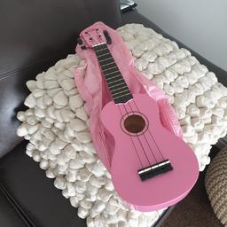 ukulele used a couple of times in school as new.