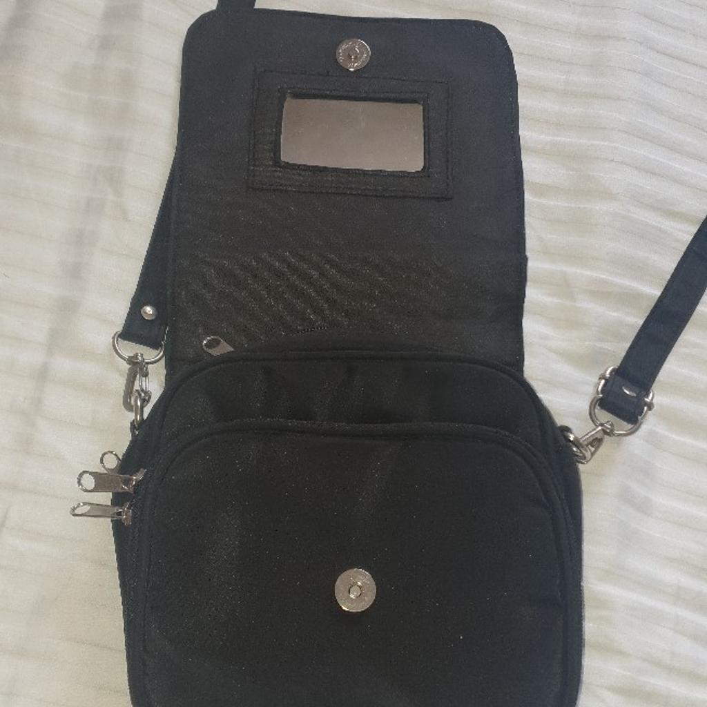 Brand new Burcardi pouch. Its got 7 different compartments. it has 3 cards department and its got small mirror too. from smoke and pets free home. very good condition. local delivery available with small amount of charge.