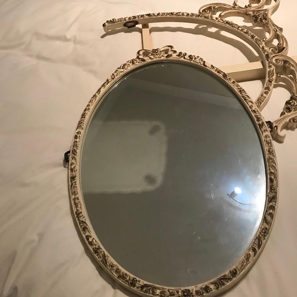Oval mirror vintage.

Oval vintage Queen Anne style design with original fixing bracket . Mirror can be detached from bracket to use on a wall. This mirror is an ideal up cycling project . Originally it was fixed to a small chest of draws which served as a small dressing table. Size 21” x 15”
