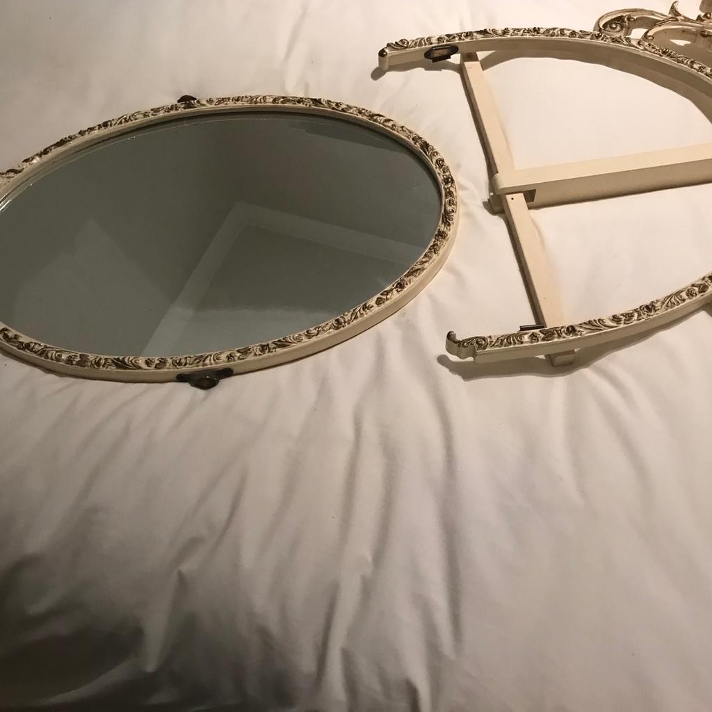 Oval mirror vintage.

Oval vintage Queen Anne style design with original fixing bracket . Mirror can be detached from bracket to use on a wall. This mirror is an ideal up cycling project . Originally it was fixed to a small chest of draws which served as a small dressing table. Size 21” x 15”