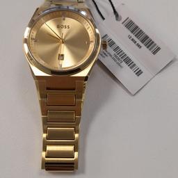 2022 Hugo Boss Steer Gold Plated Date Bracelet Quartz Watch 1502672

Women's / listed as unisex since it's a very simple design, in gold.

As appreciated in the pictures, never worn, no scratches. Just no box

Model number	1502672
Item Shape	Round
Dial Window Material Type	Mineral Glass
Display Type	Analog
Clasp Type	Push Button Deployment Clasp
Case Material	Gold Plated Stainless Steel
Case Diameter	36 mm
Case Thickness	9 mm
Band Material	Gold Plated Strap Stainless Steel
Band size	Womens Standard
Band Width	17 mm
Band Colour	Gold
Dial Colour	Gold
Bezel Material	Stainless Steel
Bezel Function	Stationary
Calendar	Date
Special Features	Water Resistant 50m
Weight	109 gr
Movement	Quartz
Finish Brushed

Date First Available ‏ : ‎ 1 Nov. 2022

3-hand Quartz Movement with Date Function
Case thickness 8.2mm / Case Diameter 36mm
Yellow gold sunray dial
Stainless steel bracelet with yellow gold Ion Plating (IP)