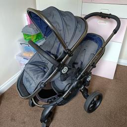 I candy peach 3 Moonlight Double buggy.
Items:
X 2 footmuffs ( 1 new)
X 2 seat liners (1 new)
X 2 rain covers
X 1 chair adapter for larger seat
X 1 adapter for car seat
X 1 bar
X 1 parasol (new)

In used condition has some wear and tear. But still in good used condition. Smoke free and pet free home. Can also be used as a single buggy.