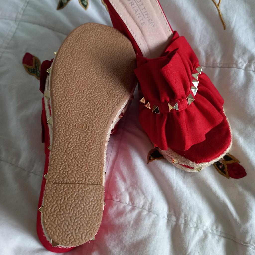Size 4 Red platforms. Brand new. lovely studded details. Great for summer.