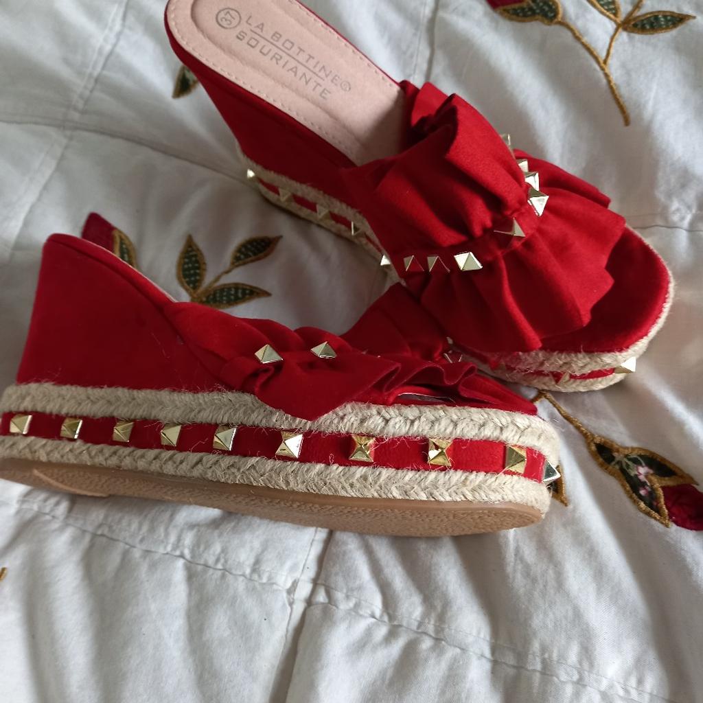 Size 4 Red platforms. Brand new. lovely studded details. Great for summer.