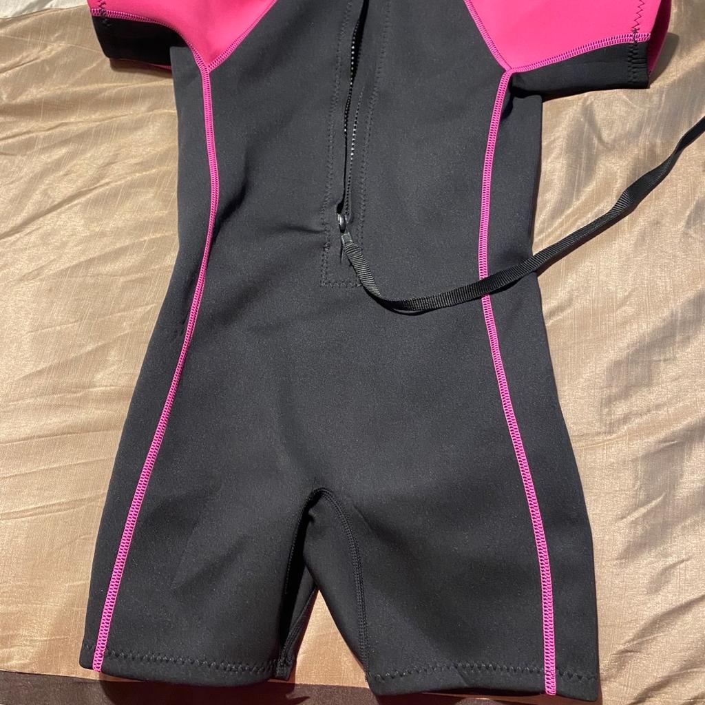 TWF Seahorse Girls Wetsuit. Used but only a handful of times (if that!). UPF 50+. High density neoprene for maximum wear. Flatlocked stitching. Zip with plastic slider & velcro ziplock. For beach & sea use. 2mm neoprene. Pet & smoke free home. Collection only. REDUCED