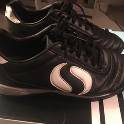 Black & white Astro football trainers size 5